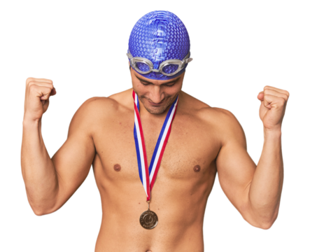 Hispanic male swimmer with gold medal celebrating victory