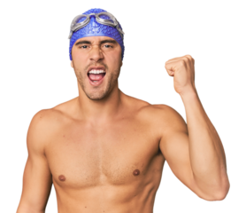 Close-up of Hispanic male swimmer with goggles, winner's attitude