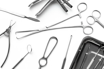 Surgery equipment and metal tools on white background, top view. Medical instruments