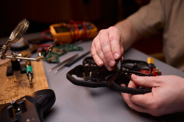 Conducting Detailed and Precise Repair Work Using Various Tools and Electronic Components