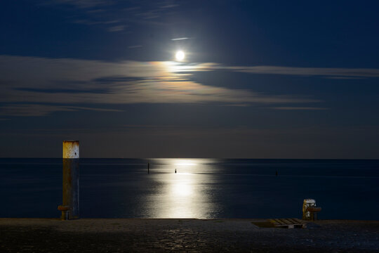 Reflection of moonlight in Wadden sea at island of Terschelling, Netherlands