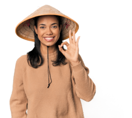 Young Filipina with Vietnamese hat cheerful and confident showing ok gesture.