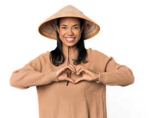 Young Filipina with Vietnamese hat smiling and showing a heart shape with hands.