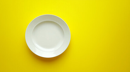 white empty plate isolated on yellow background