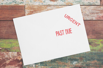Past Due card on weathered wood
