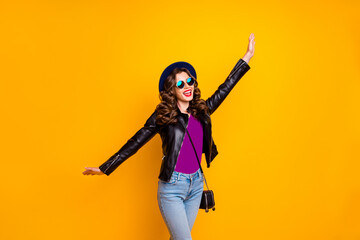 Photo of careless lady dancing on street overjoyed by spring warm weather wear stylish outfit isolated yellow color background