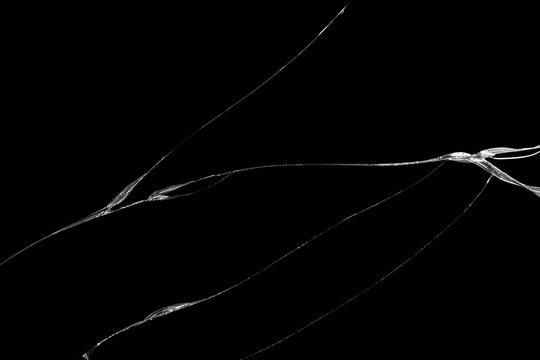 Close-up wrinkles and cracks on LCD screen glass display from smartphone, tablet or monitor from effect smash and fall bumps with detail pattern background, for use as a pattern on tiles or wallpaper