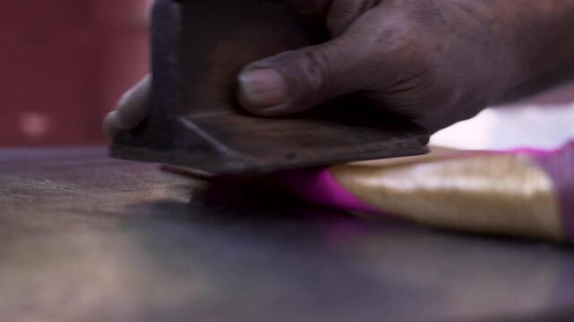 Rolling of handmade of Lac bangle making in progress