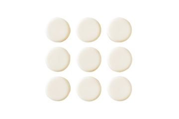 Round milk tablets arranged neatly isolated on cut out PNG or transparent background. Vitamins and calcium nourish body. Emphasizing their smooth texture and creamy color. Health and dietary product.