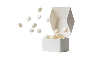 Round milk tablets floating in mid-air out of cardboard box isolated on cut out PNG or transparent background. Health and dietary product concept. Vitamins and calcium nourish body.