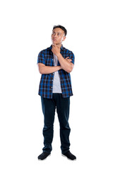 Portrait of an Asian Indonesian man in a shirt posing with a thinking expression isolated over a white background. Copy space