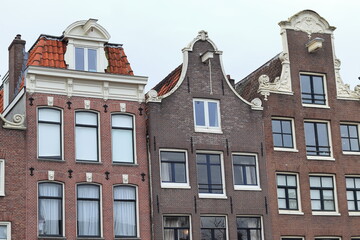 Amsterdam Singel Canal House Facades Close Up with White Sky, Netherlands