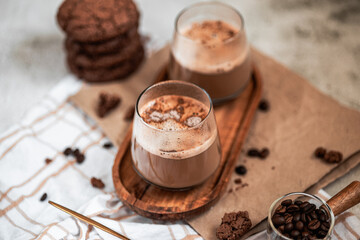 coffee with foam in a glass, two drinks, golden spoon, coffee beans, Americano, cappuccino, mocha, homemade pastries, cooking, chocolate cookies, light composition, macro, flatlay, coffee with sweets