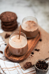 coffee with foam in a glass, two drinks, golden spoon, coffee beans, Americano, cappuccino, mocha, homemade pastries, cooking, chocolate cookies, light composition, macro, flatlay, coffee with sweets