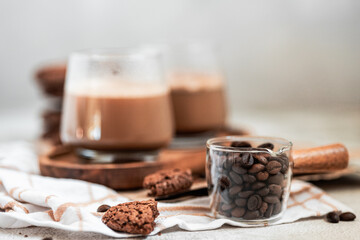 coffee beans in a glass, container, milk jug, macro, selective focus, Americano, espresso, light background, making coffee, morning drink, brewing coffee, chocolate cookies, flatlay, still life, food 