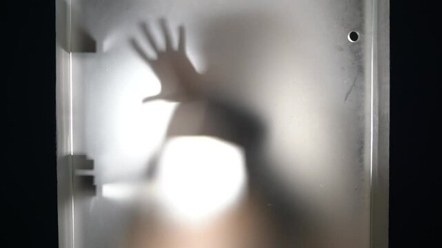 hands and body of raped woman silhouette- domestic family sexual violence at home in apartment - increase in rape and gender-based abuse - shock and fear due to a feminicide and suicide for depression