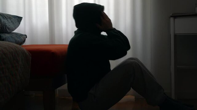 hands and body of raped woman silhouette- domestic family sexual violence at home in apartment - increase in rape and gender-based abuse - shock and fear due to a feminicide and suicide for depression