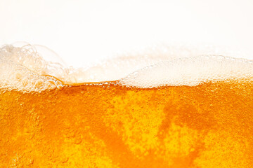 Close up bright orange Oil or beer splash texture and nature waves, Beautiful waves curve and little bubbles smooth for graphic design and background, Oil Bubbles, Soft beer bubbles, Selective focus