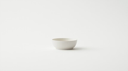 Minimalist White Ceramic Bowl on Plain Background Emphasizing Simplicity and Elegance