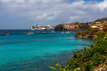 cruise ships docked in the port of Saint George's, Grenada, Caribbean Islands seen from the Grand Anse Beach