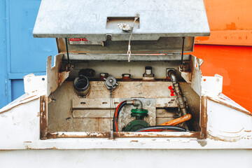 Diesel fuel bowser with hand pump and hose at construction site 