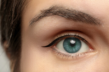 Fototapeta premium Closeup view of woman with blue eyes