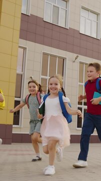 happy children school backpacks run game recess group team runners childhood boy girl dream, youth team, spirited run, youthful energy, joyful children, childhood exuberance, group of kids, kids in