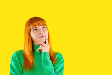 Brightly colored woman thoughtfully contemplating ideas against yellow backdrop