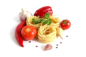 Fresh ripe harvest of vegetables lies on white isolated background with dry pasta before cooking.	