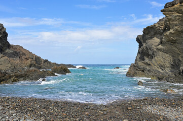 Panorama view of a bay by the pirate caves of Ajuy in Fuerteventura. Blue atlantic ocean with...