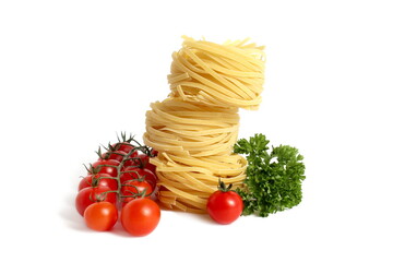On a white background there are baskets of pasta on top of each other with parsley and tomatoes.
