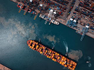 container ship and commercial port in deep sea loading and unloading cargo from container ship...