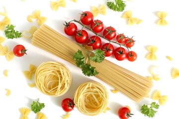 Fresh ripe harvest of vegetables lies on white isolated background with dry pasta before cooking.	