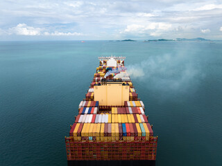 cargo container ship carrying sailing in sea import export goods and distributing products to...