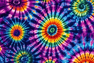 Colorful tie dye pattern abstract background. Abstract textured spiral folded rainbow colorful tie dye textured background.