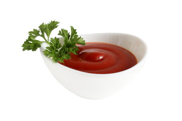 There is a white bowl with tomato sauce on a white isolated background.