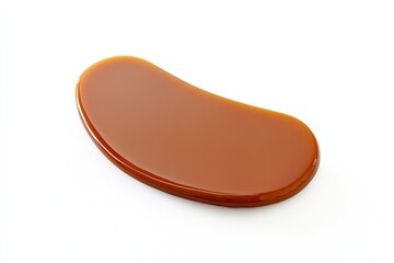 Smooth, glossy caramel shape with rich, warm brown color, inviti