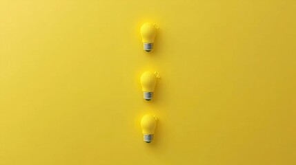 Fototapeta premium Three Yellow Light Bulbs on a Bright Yellow Background Representing Creativity and Innovation