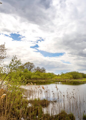 Lake with a cloudy sky in the background