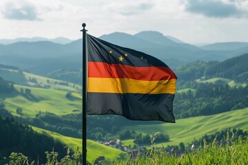German flag flying in a sunny countryside setting