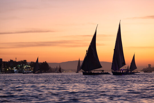 Tourists in a Felucca boat on the Nile River in Luxor Thebes - Egypt