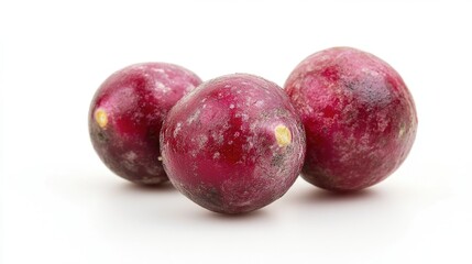 Obraz premium Three plums sitting on a white surface with a white background, ideal for food or kitchen-themed projects