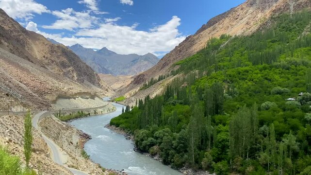 Beautiful landscape with mountains and the Drass River at Chanigound village in Kargil, Ladakh, India.