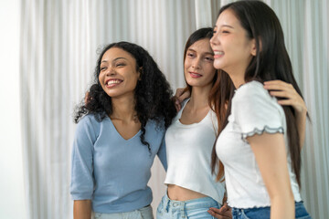Diverse group of women friends smiling and talking together, happy female friendship bonding joyful conversation and connection, empowerment support, trust and love, laughter positivity at home