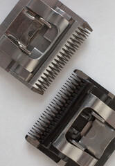 Two removable spare  clipper head on white  background. Grooming concept.