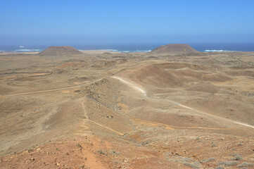 Endless lonesome volcanic landscape and cold lava fields in the nature park Caminos Naturales during a hike to the volcano de Bayuyo, Fuerteventura, Canary Islands
