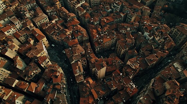 Aerial View of a dense European city with terracotta roofs and narrow streets