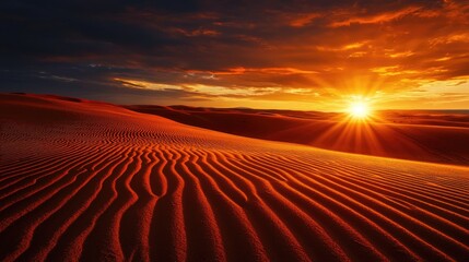 Naklejka premium Stunning Desert Sunset Over Rippling Sand Dunes with Warm Colors