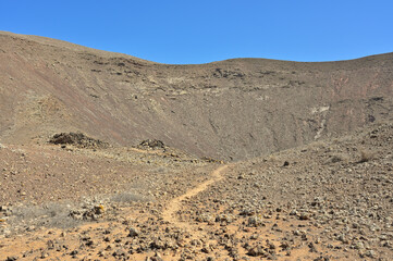 Volcanic landscape, blue sky, cold lava fields in the nature park Caminos Naturales at a hike to...