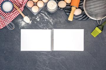 Background with baking ingredients and blank book. Baking ingredients.